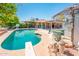 Enjoy a refreshing swim in the pool, complemented by lush greenery at 16425 N 46Th Dr, Glendale, AZ 85306