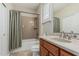 Bathroom featuring a granite countertop, vanity, toilet, and bathtub with shower and tiled surround at 16747 W Berkeley Rd, Goodyear, AZ 85395