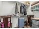 Walk-in closet with built-in shelving and plenty of storage space at 16747 W Berkeley Rd, Goodyear, AZ 85395