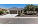 Beautiful single-story home featuring a well-manicured desert landscape, a three-car garage, and a welcoming entrance at 16747 W Berkeley Rd, Goodyear, AZ 85395