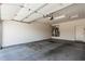 Spacious garage with an automatic door, water heater, and room for vehicles and storage at 16747 W Berkeley Rd, Goodyear, AZ 85395