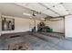 Spacious garage with an automatic door, water heater, and room for vehicles and bicycles at 16747 W Berkeley Rd, Goodyear, AZ 85395