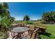 Outdoor patio seating overlooking the lush green golf course with mountain views at 16747 W Berkeley Rd, Goodyear, AZ 85395