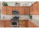 Charming kitchen featuring stainless steel appliances and attractive granite countertops at 16747 W Berkeley Rd, Goodyear, AZ 85395