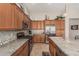 Well-equipped kitchen with stainless appliances, granite countertops, and ample cabinet space at 16747 W Berkeley Rd, Goodyear, AZ 85395