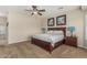 Spacious main bedroom featuring ceiling fan and plush carpeting at 16747 W Berkeley Rd, Goodyear, AZ 85395