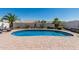 Backyard pool surrounded by desert landscaping, offering a private oasis for relaxation and entertainment at 16747 W Berkeley Rd, Goodyear, AZ 85395
