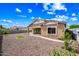 Backyard featuring low-maintenance landscaping, a gravel bed, and a square grass patch at 16763 W Magnolia St, Goodyear, AZ 85338