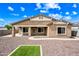 The backyard features low-maintenance gravel landscaping and a small grass patch at 16763 W Magnolia St, Goodyear, AZ 85338
