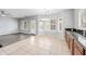Charming dining area with a modern chandelier, big windows, and neutral paint at 16763 W Magnolia St, Goodyear, AZ 85338