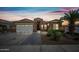 Inviting single-story home featuring a two-car garage and desert landscaping at 16763 W Magnolia St, Goodyear, AZ 85338
