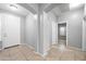 Foyer with tiled floor and views of a bedroom and entryway at 16763 W Magnolia St, Goodyear, AZ 85338
