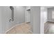 Hallway with tile flooring and inset display area at 16763 W Magnolia St, Goodyear, AZ 85338
