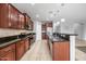 Updated kitchen with tile flooring, granite countertops, and stainless steel appliances at 16763 W Magnolia St, Goodyear, AZ 85338