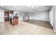 Bright open floor plan with hardwood floors, ceiling fan, and neutral paint at 16763 W Magnolia St, Goodyear, AZ 85338