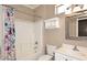 Bathroom with a bathtub, shower, tile, and sink at 17630 N Somerset Dr, Surprise, AZ 85374