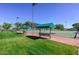 Bocce ball court featuring manicured lawns, shaded benches, and easy access to the community park at 17630 N Somerset Dr, Surprise, AZ 85374