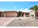 Single-story home featuring desert landscaping and a two-car garage at 17630 N Somerset Dr, Surprise, AZ 85374