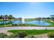 Scenic view of a well-maintained golf course with a water feature at 17630 N Somerset Dr, Surprise, AZ 85374