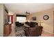 Spacious living room with tile floors, stylish furniture, and ceiling fan at 17630 N Somerset Dr, Surprise, AZ 85374