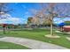 Inviting neighborhood park featuring well-maintained green space, playground, and shaded seating areas at 17630 N Somerset Dr, Surprise, AZ 85374