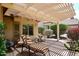 Shaded patio with comfortable seating, ideal for outdoor relaxation and enjoying the landscaped surroundings at 17630 N Somerset Dr, Surprise, AZ 85374