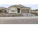 Charming single-story home featuring a two-car garage and low maintenance desert landscaping at 17731 W Onyx Ave, Waddell, AZ 85355