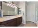 Bright bathroom with double vanity, framed mirrors, sleek fixtures, and plenty of storage space at 17900 W Briarwood Dr, Goodyear, AZ 85338