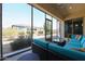 Screened-in patio with stylish furniture, a beautiful view of the backyard landscaping at 17900 W Briarwood Dr, Goodyear, AZ 85338
