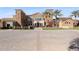 Exterior view of the village center with manicured grounds and attractive architecture at 17900 W Briarwood Dr, Goodyear, AZ 85338