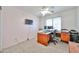 Home office/bedroom features carpet, good light, desk, and file cabinets for organization and productivity at 18047 W Caribbean Ln, Surprise, AZ 85388