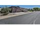 Charming two-story home featuring a two-car garage and desert landscaping, offering curb appeal at 18047 W Caribbean Ln, Surprise, AZ 85388