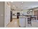 Modern kitchen featuring granite countertops, stainless steel appliances, and ample white cabinetry at 18047 W Caribbean Ln, Surprise, AZ 85388