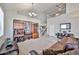 Spacious living room with high ceilings, staircase, and decorative shelving, perfect for entertaining at 18047 W Caribbean Ln, Surprise, AZ 85388