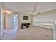 Bright loft area with a ceiling fan, carpet floors, and an open view to the downstairs at 18047 W Caribbean Ln, Surprise, AZ 85388