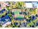 Aerial view showcases the tennis courts and lush landscaping within the community at 1806 W Fetlock Trl, Phoenix, AZ 85085
