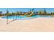 A community pool with slides and splash pad, surrounded by seating and landscaping at 1806 W Fetlock Trl, Phoenix, AZ 85085