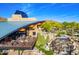 Sophisticated clubhouse with outdoor seating area and serene waterfall feature, surrounded by desert landscaping at 1806 W Fetlock Trl, Phoenix, AZ 85085