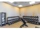 A variety of weights and weight lifting equipment in the gym in the Fireside at Desert Ridge community at 1806 W Fetlock Trl, Phoenix, AZ 85085