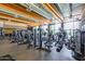 Fully equipped gym with treadmills and workout machines in a well-lit area with large windows and exposed ceiling at 1806 W Fetlock Trl, Phoenix, AZ 85085