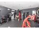 Spacious in-home gym featuring various exercise equipment, weights, and rubber flooring at 1806 W Fetlock Trl, Phoenix, AZ 85085