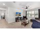Inviting living room with stylish decor, a ceiling fan, and bright natural light at 1806 W Fetlock Trl, Phoenix, AZ 85085