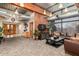 Cozy lobby area with comfortable seating, a TV, and views into the hallway at Fireside at Desert Ridge community at 1806 W Fetlock Trl, Phoenix, AZ 85085