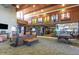 Comfortable lobby area with wooden features, lounge chairs, and access to the gym in the Fireside at Desert Ridge community at 1806 W Fetlock Trl, Phoenix, AZ 85085