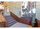 Unique stairway design featuring a climbing wall and industrial-style railings at 1806 W Fetlock Trl, Phoenix, AZ 85085