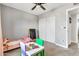 Cozy bedroom featuring neutral walls, carpet flooring, closet and ceiling fan at 1914 W Onza Ave, Mesa, AZ 85202