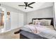 Comfortable bedroom with a bed and an open view of sliding closet doors at 1914 W Onza Ave, Mesa, AZ 85202
