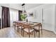 Cozy dining area with a wooden table, stylish chairs, and modern lighting at 1914 W Onza Ave, Mesa, AZ 85202
