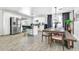 Open concept kitchen with stainless steel appliances and adjacent dining area at 1914 W Onza Ave, Mesa, AZ 85202