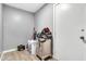 Convenient laundry room with ample storage space and tile flooring at 1914 W Onza Ave, Mesa, AZ 85202